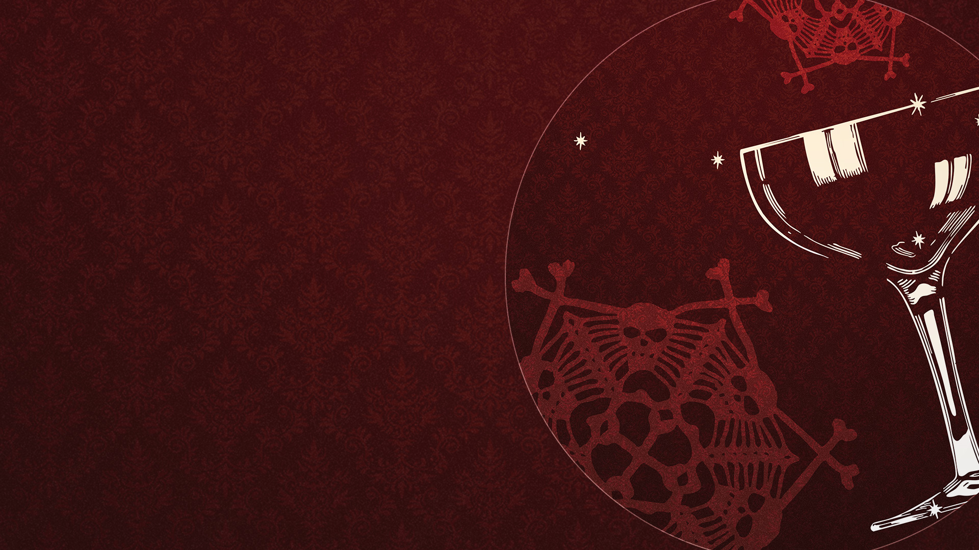 A cocktail glass atop a background full of lace with a skull and bones pattern